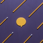 Speech bubble surrounded by wooden pencils